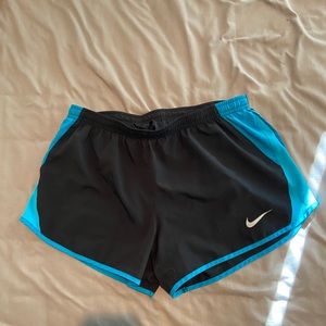 Blue and black Nike athletic shorts